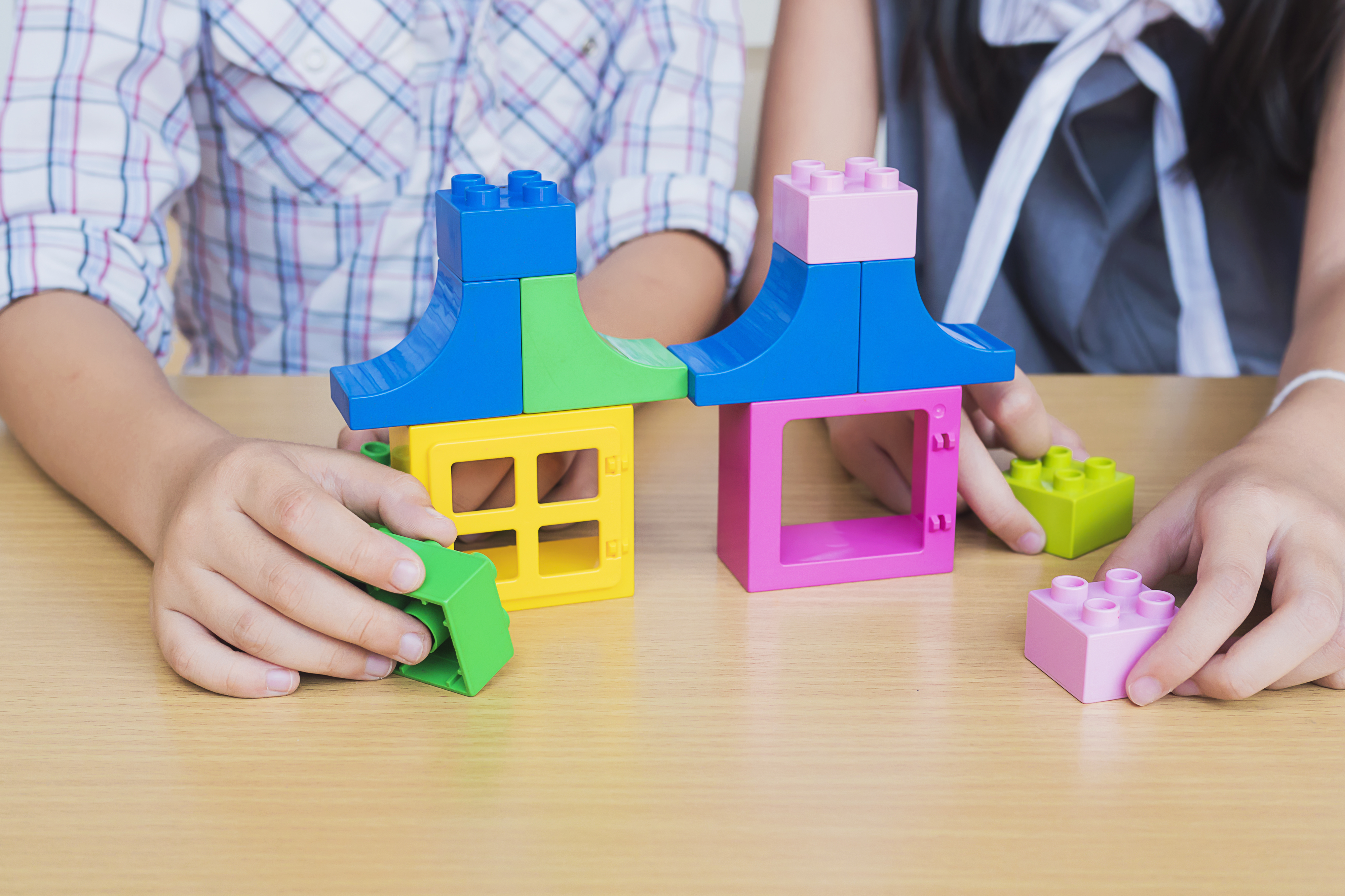 Kids playing pieces plastic creative construction blocks